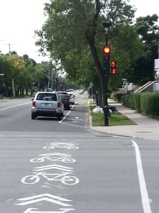 Simple bike path - parked cars separate bikes and moving cars
